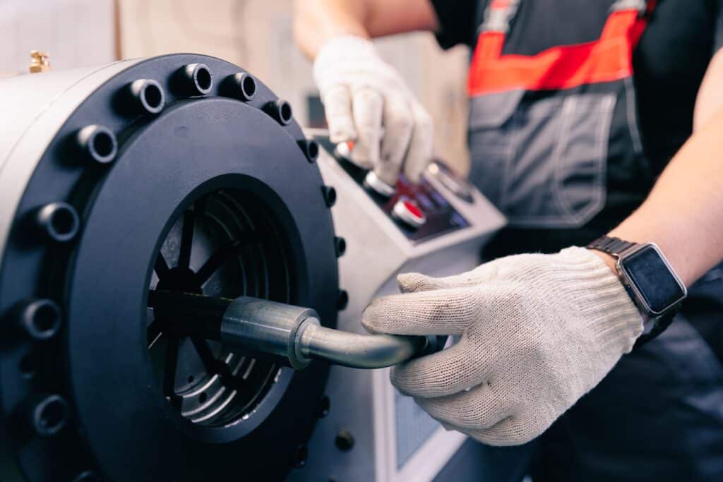 Industrial,worker,control,cnc,press,for,connection,pipe,with,hydraulic