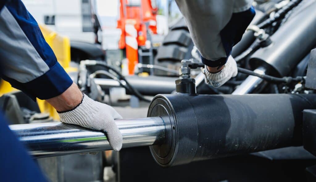 Worker,mechanic,check,pipe,system,of,hydraulic,hose,valves,in