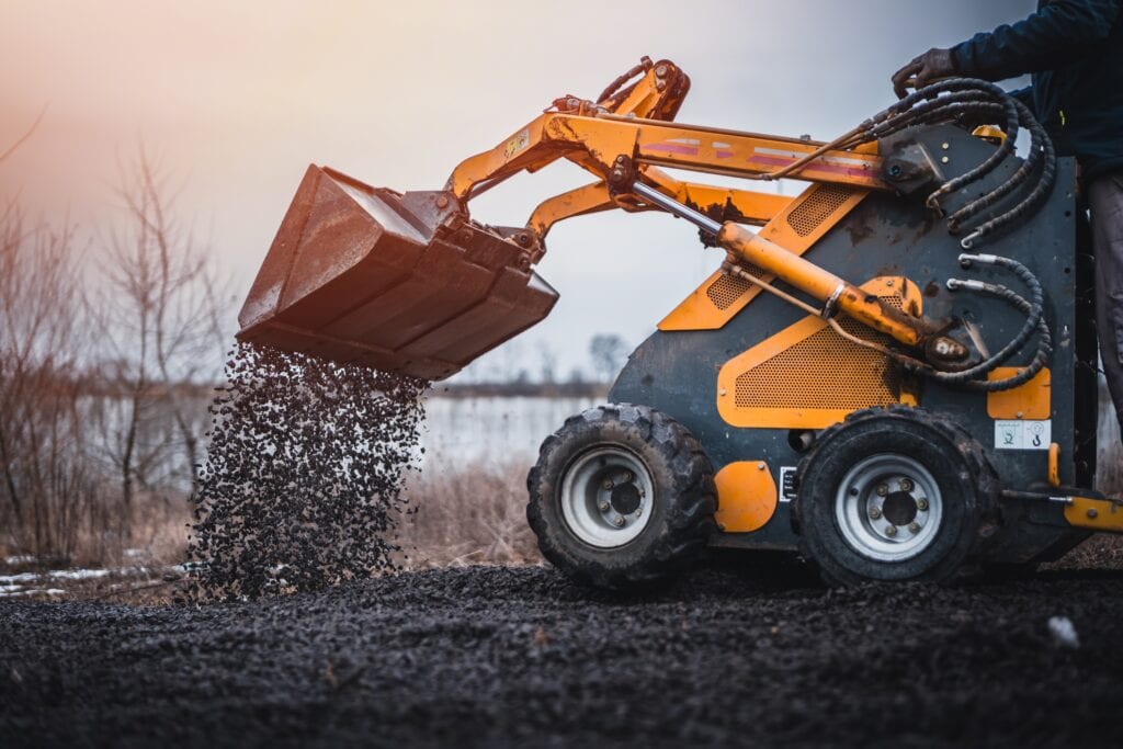 Mini,loader,with,bucket.,mini,loader,is,preparing,the,terrain.
